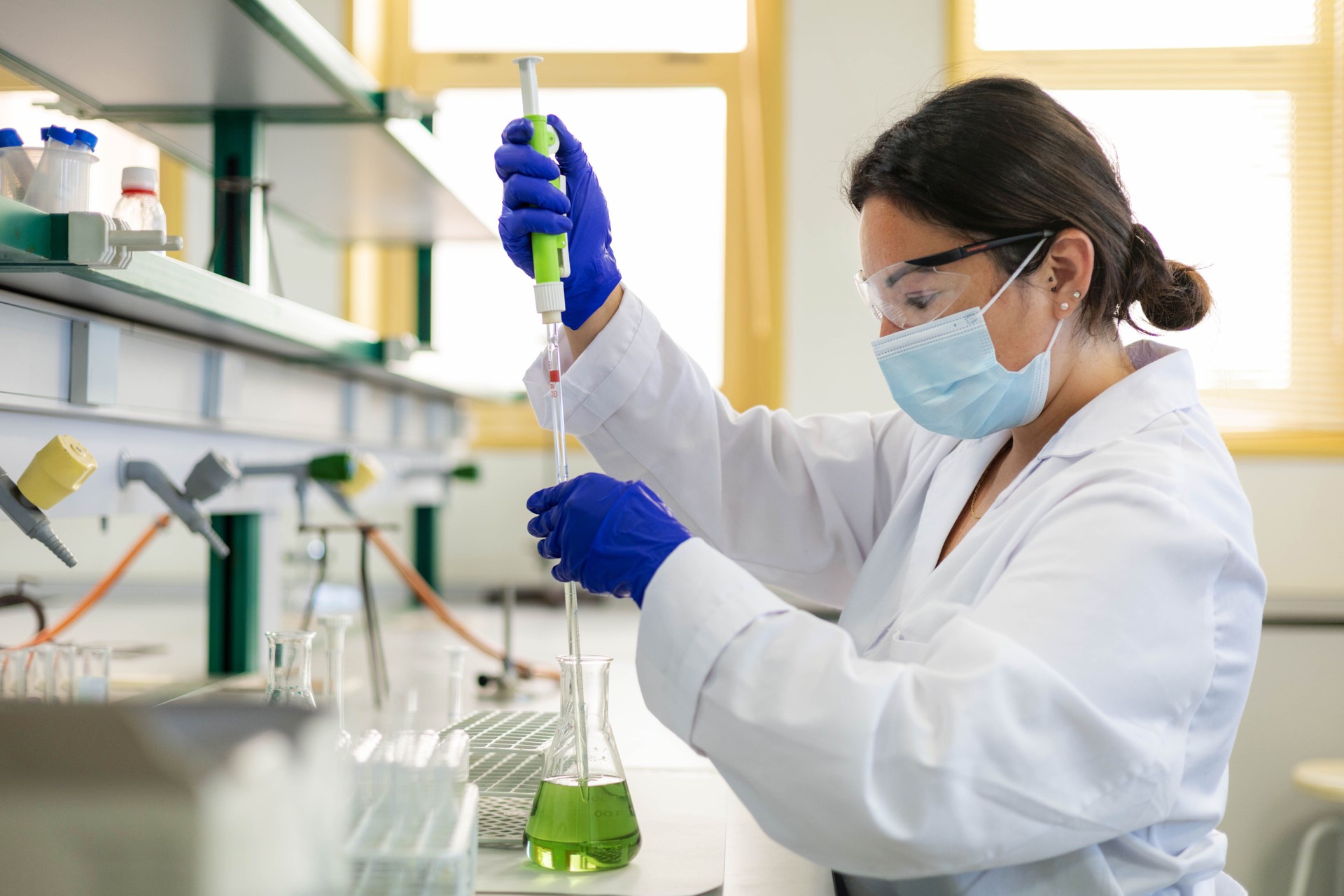 a scientist in the lab doing an experiment